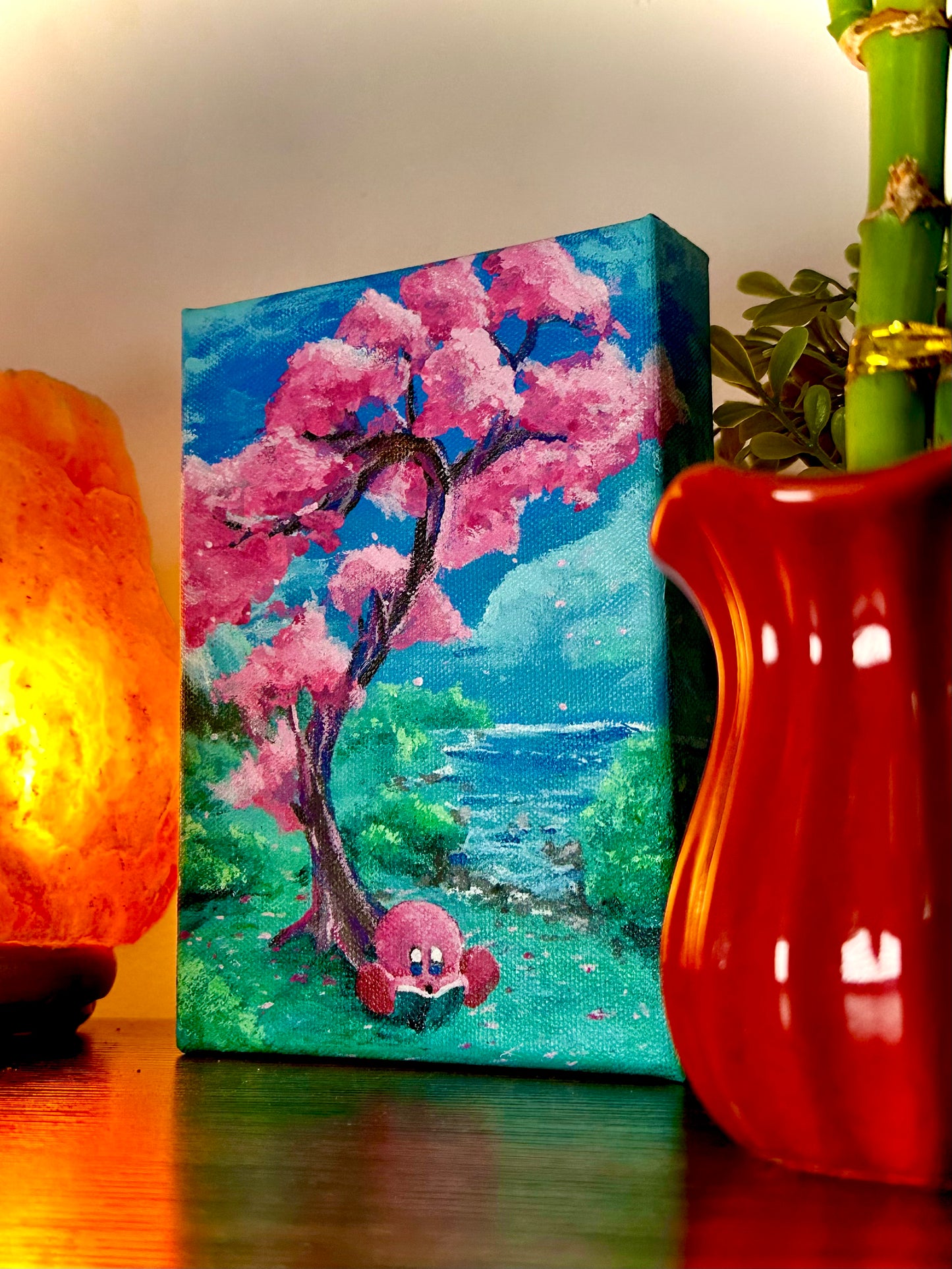 A Hungry Pink Blob Reading Under A Tree